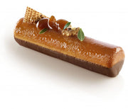 Bûche caramel et chocolat décorée aux noix