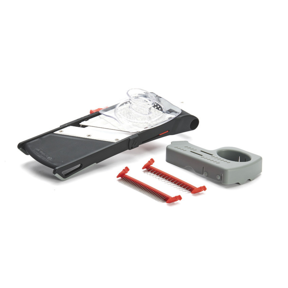 Mandoline noire avec poussoir transparent, support gris et deux peignes à julienne rouges