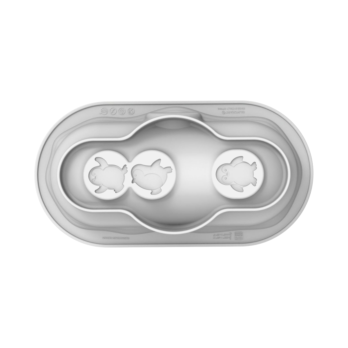 Vue de dessus du moule en silicone Silikomart Igloo avec trois empreintes pingouins au fond