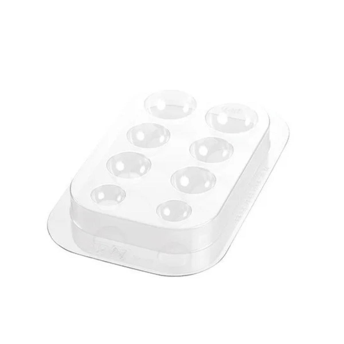 Moule transparent à huit empreintes rondes de différentes tailles pour créer les yeux et les bras du Père Noël en chocolat.